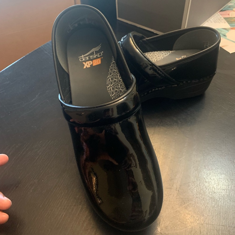 Dansko patent black, wore once inside never outdoors.